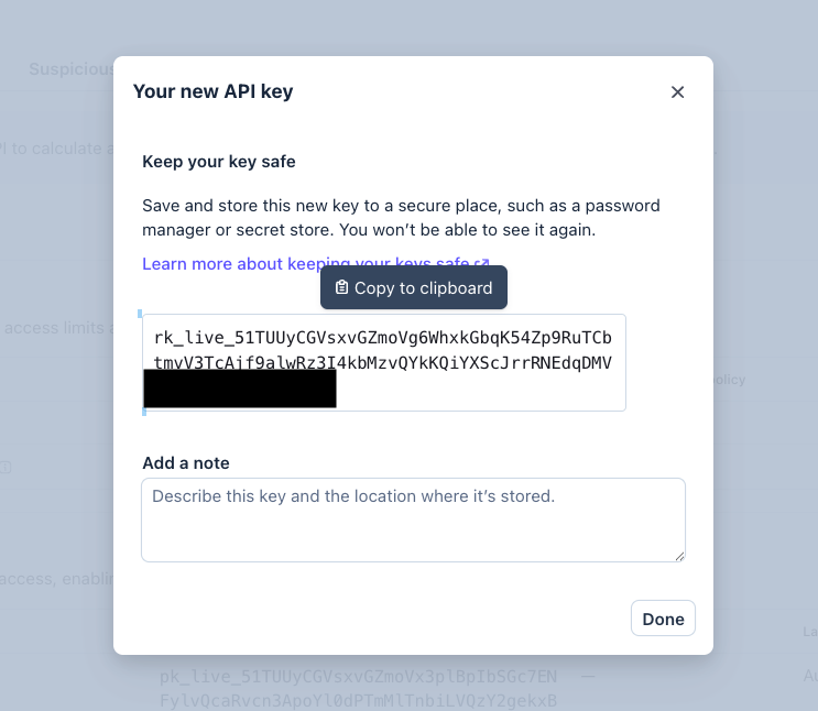 Stripe Your new API key modal showing the rk_live restricted key and Copy to clipboard